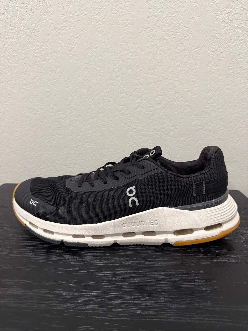 On Running Men's Black and White Cloudtec Trainer with Gum Outsole